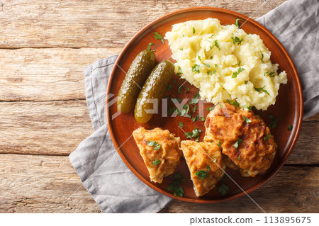 Czech food Dutch Schnitzel Holandsky Rizek served with mashed potatoes closeup on the plate. Horizontal top view Czech food Dutch Schnitzel Holandsky Rizek served with mashed potatoes closeup on the plate. Horizontal top view 113895675