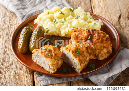 Czech food Dutch Schnitzel Holandsky Rizek served with mashed potatoes closeup on the plate. Horizontal 113895681
