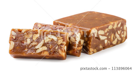 Caramel sherbet with nuts cut into pieces on a white background. Isolated Caramel sherbet with nuts cut into pieces on a white background. Isolated 113896064
