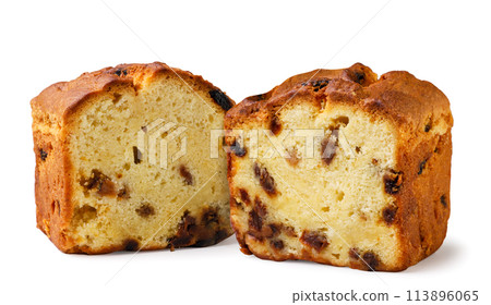 Halves of a cupcake with raisins close-up on a white background. Isolated Halves of a cupcake with raisins close-up on a white background. Isolated 113896065