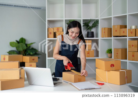 Woman asian use scotch tape to attach parcel boxes to prepare goods for the process of packaging, shipping, online sale internet marketing ecommerce concept startup business idea Woman asian use scotch tape to attach parcel boxes to prepare goods for the process of packaging, shipping, online sale internet marketing ecommerce concept startup business idea 113896319
