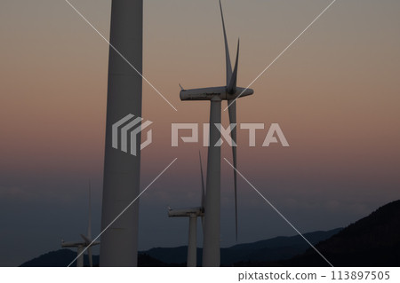 Evening scenery with wind turbines 113897505