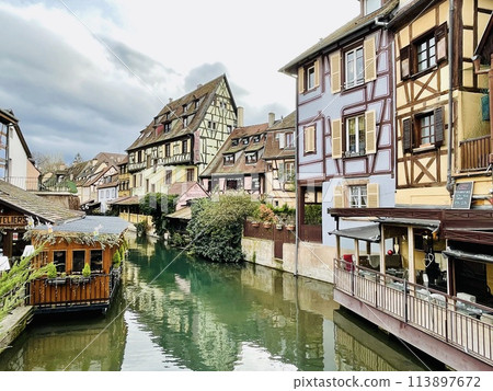 Urban medieval landscape of Alsace, water canal Colmar, France. Urban medieval landscape of Alsace, water canal Colmar, France. 113897672