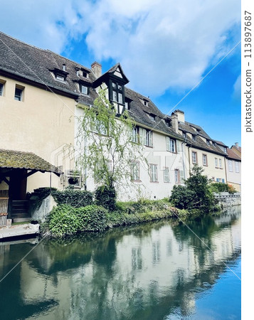 Urban medieval landscape of Alsace, water canal Colmar, France.  113897687