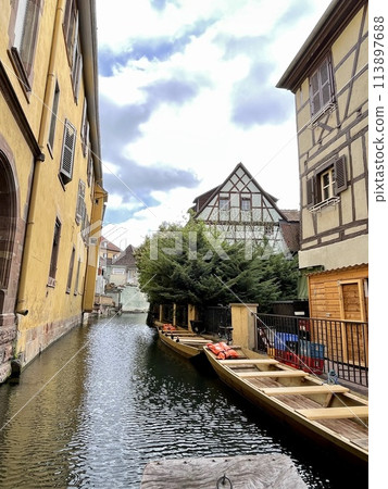 Urban medieval landscape of Alsace, water canal Colmar, France. Urban medieval landscape of Alsace, water canal Colmar, France. 113897688