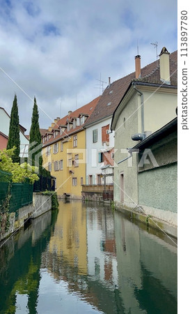 Urban medieval landscape of Alsace, water canal Colmar, France. Urban medieval landscape of Alsace, water canal Colmar, France. 113897780