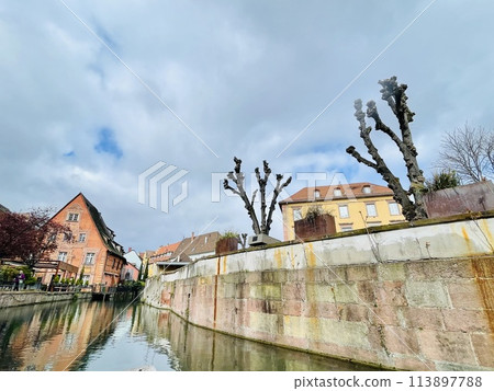 Urban medieval landscape of Alsace, water canal Colmar, France. Urban medieval landscape of Alsace, water canal Colmar, France. 113897788