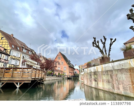 Urban medieval landscape of Alsace, water canal Colmar, France.  113897798