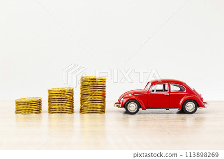 Toy car and toy gold coins Toy car and toy gold coins 113898269