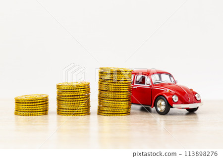 Toy car and toy gold coins Toy car and toy gold coins 113898276