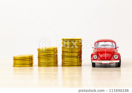 Toy car and toy gold coins 113898286