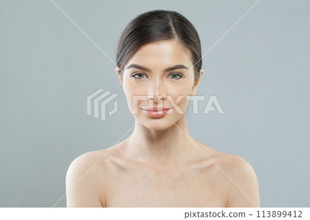 Pretty healthy model woman with beautiful skin and cute smile on white background, studio portrait. Pretty healthy model woman with beautiful skin and cute smile on white background, studio portrait. 113899412