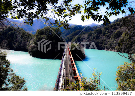 Blue lake and railroad tracks Blue lake and railroad tracks 113899437