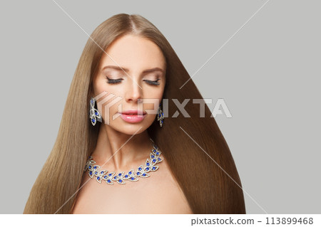 Nice glamorous woman with brown hair, makeup and gold jewelry closeup fashion beauty portrait Nice glamorous woman with brown hair, makeup and gold jewelry closeup fashion beauty portrait 113899468