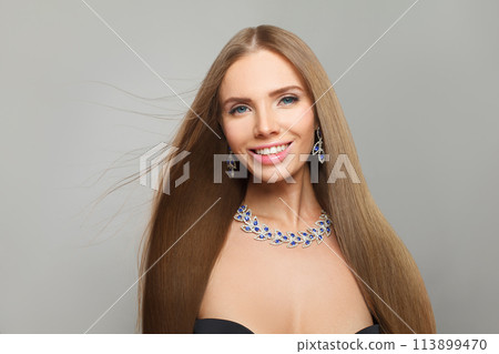 Happy fashionable jewelry woman fashion model with straight smooth healthy long hair, make-up Happy fashionable jewelry woman fashion model with straight smooth healthy long hair, make-up 113899470