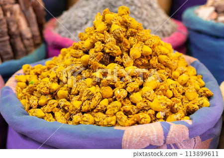 Sack with dried yellow flowers 113899611