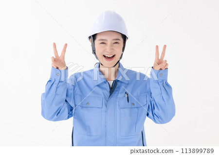 Woman in work clothes peace sign 113899789