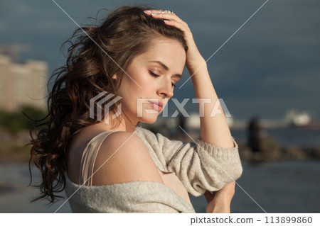 Sunny young lady brunette model on sea beach. Beauty woman with makeup Sunny young lady brunette model on sea beach. Beauty woman with makeup 113899860