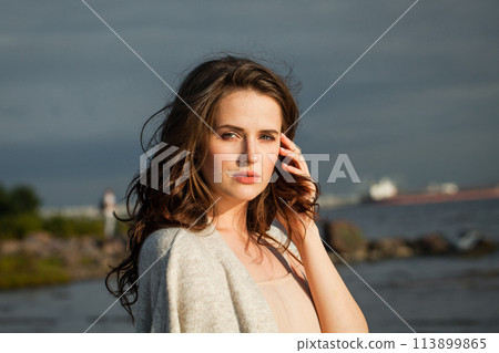 Nice young lady brunette model on sea beach. Beauty woman with makeup Nice young lady brunette model on sea beach. Beauty woman with makeup 113899865