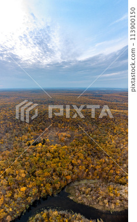 Aerial autumn river curve in forest on hills 113900150