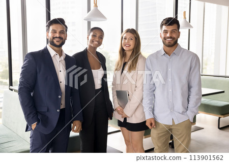 Happy multiethnic team of young business colleagues standing for portrait Happy multiethnic team of young business colleagues standing for portrait 113901562