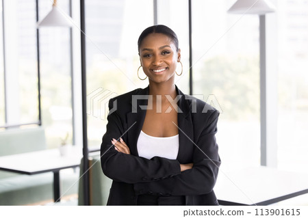 Happy attractive African business leader woman looking at camera 113901615