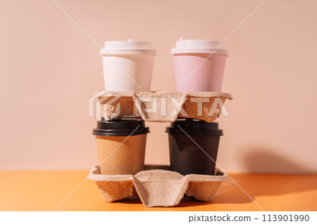 Paper cups in a tray stand on top of each other Paper cups in a tray stand on top of each other 113901990