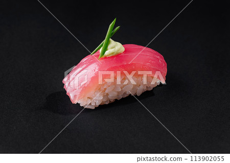 Gourmet tuna nigiri sushi with wasabi on black background Gourmet tuna nigiri sushi with wasabi on black background 113902055