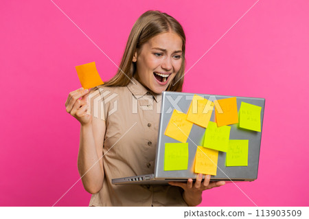 Exhausted freelancer woman with pasted sticker notes use laptop confused by big routine work loading 113903509