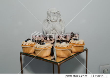 Sweet cakes at a wedding banquet. Catering, sweet festive buffet. Candy bar 113904592