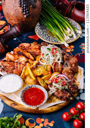 Traditional georgian feast with assorted grilled meats Traditional georgian feast with assorted grilled meats 113904885