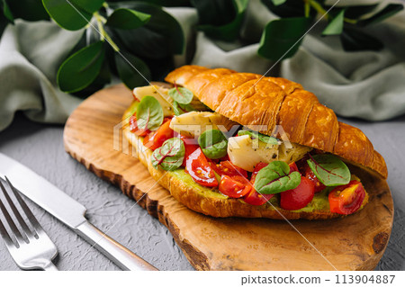 Gourmet tomato and mozzarella croissant sandwich Gourmet tomato and mozzarella croissant sandwich 113904887