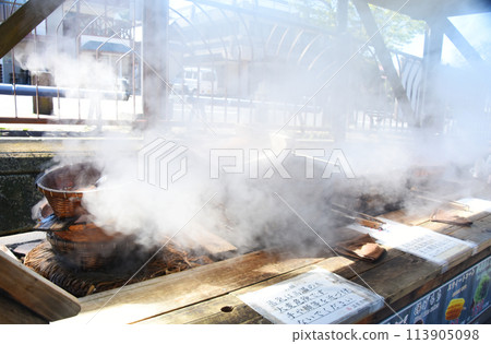 Steam rising from a steam shop in Kirishima Onsen 113905098