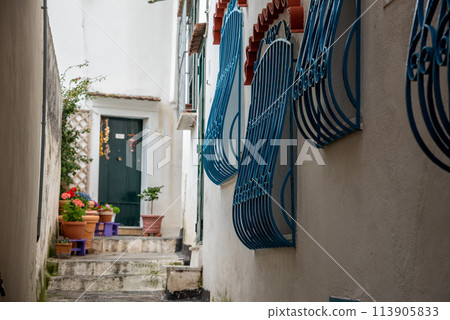 Alleyway and scenic window grilles in Amalfi, Italy Alleyway and scenic window grilles in Amalfi, Italy 113905833