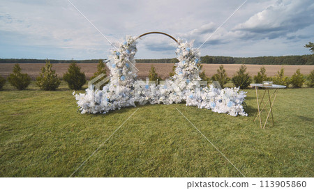 White wedding arch before the ceremony. White wedding arch before the ceremony. 113905860