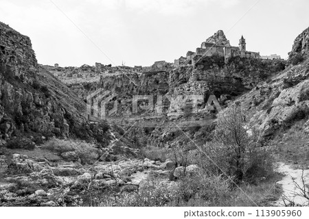 Hiking through the canyon in Matera, Southern Italy 113905960