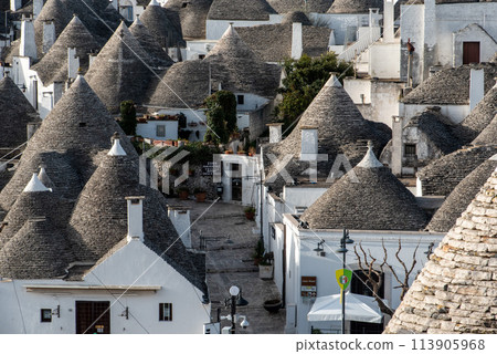 Scenic cityscape of downtown Alberobello with its famous Trulli buildings, Italy Scenic cityscape of downtown Alberobello with its famous Trulli buildings, Italy 113905968