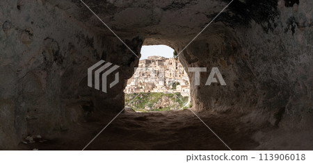 Scenic view of historic downtown with its cathedral, photo taken from a cave house, Southern Italy 113906018