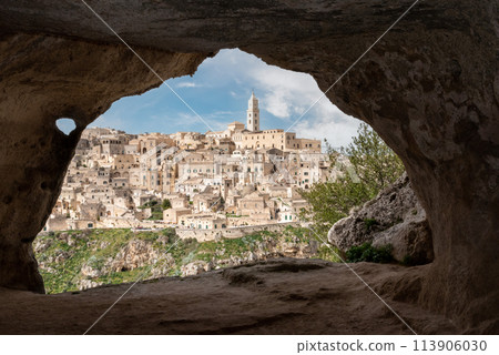 Scenic view of historic downtown with its cathedral, photo taken from a cave house, Southern Italy 113906030
