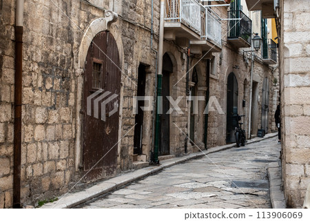 An abandoned narrow and stony alleyway in downtown Bari, Southern Italy An abandoned narrow and stony alleyway in downtown Bari, Southern Italy 113906069