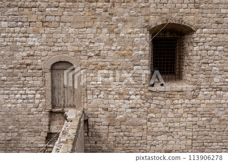 Door and window at the castle of Trani, Italy 113906278
