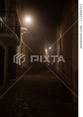 A cone of light in an alley somewhere in Ravello, Italy 113906341
