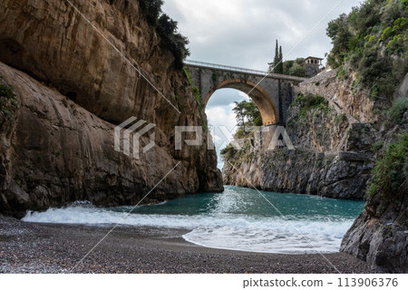 Scenic arch bridge at the Fjord of Fury, Amalfi Coast of Italy 113906376