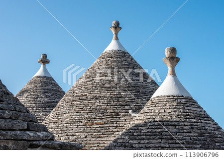 Scenic roofs of houses in historic Trulli district in Alberobello, Italy Scenic roofs of houses in historic Trulli district in Alberobello, Italy 113906796