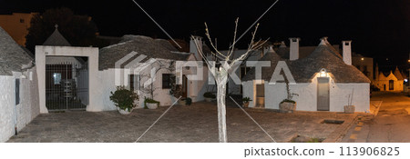 Scenic abandoned street in the Trulli district of Alberobello at night, Italy Scenic abandoned street in the Trulli district of Alberobello at night, Italy 113906825