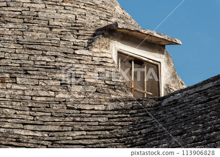 Close view of a iconic trullo roof in Alberobello, Italy Close view of a iconic trullo roof in Alberobello, Italy 113906828