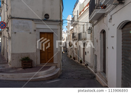 Enchanted empty alleyway in Monte Sant Angelo, Gargano peninsula in Southern Italy 113906893