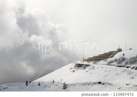 Mountain winter landscape. Mount Grappa war memorial building view Mountain winter landscape. Mount Grappa war memorial building view 113907472
