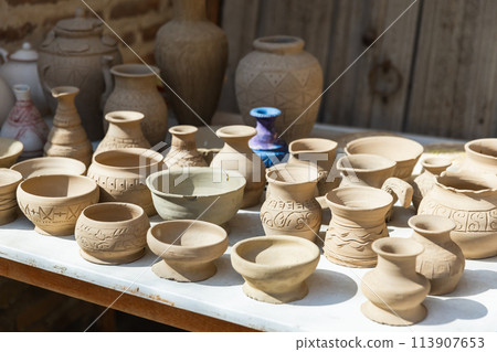 Clay earthenware represented at a street bazaar Clay earthenware represented at a street bazaar 113907653