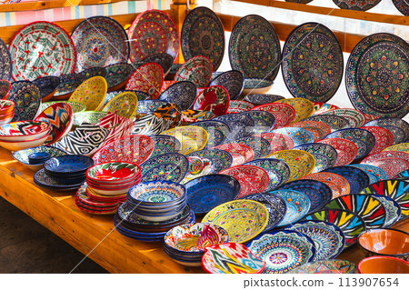 Handmade Uzbek plates and bowls with colorful traditional patterns Handmade Uzbek plates and bowls with colorful traditional patterns 113907654